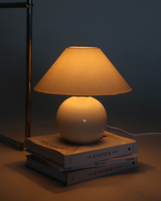 Glossy Ceramic Globe Table Lamp — close-up of label and production detail