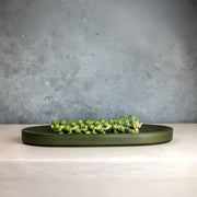 Micro Terrazzo Concrete Oval Platter — close-up of label and production detail