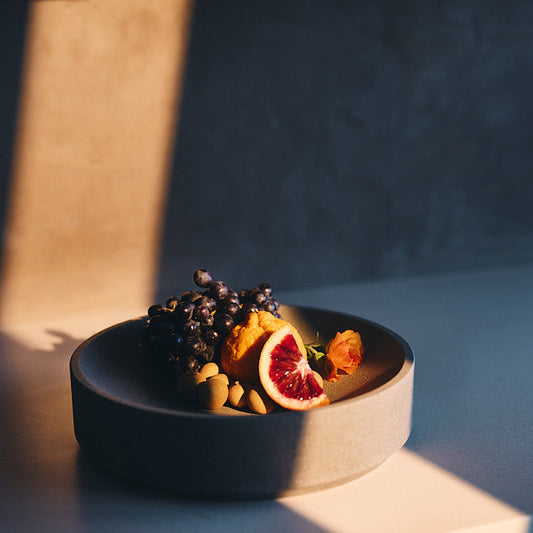 Micro Terrazzo Concrete Round Platter — Thick-walled concrete platter in five micro terrazzo finishes, for table or counter