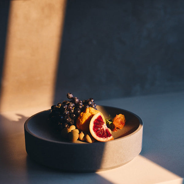 Micro Terrazzo Concrete Round Platter — Thick-walled concrete platter in five micro terrazzo finishes, for table or counter
