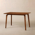 Curved-Leg Solid Wood Dining Table — FSC-certified solid wood dining table with curved legs, seats four comfortably