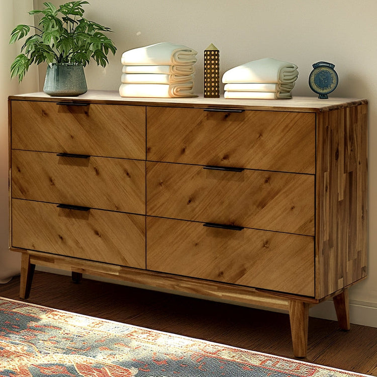 Mid-Century Wood-Grain Six-Drawer Dresser — Six-drawer dresser with chevron wood-grain panels and tapered mid-century legs