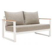 Olefin Cushion Powder-Coat Outdoor Loveseat styled in an outdoor living space