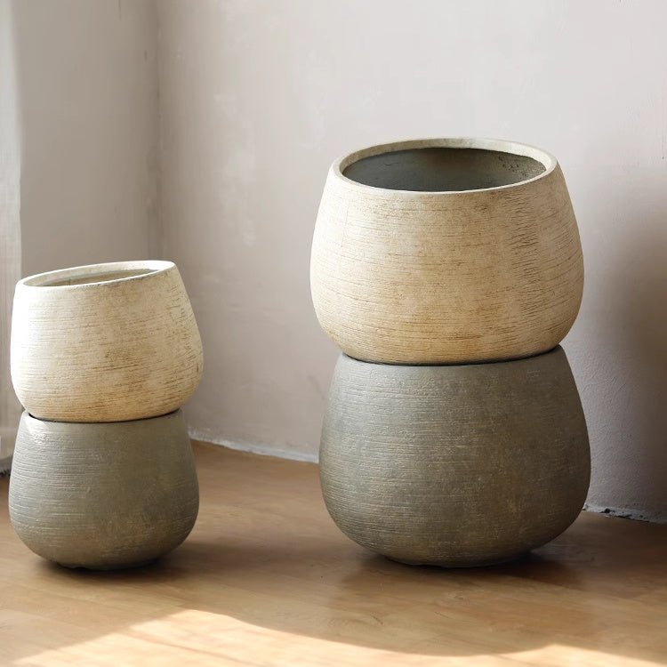 Scored Globe Cement Planter — globe-form magnesium oxide planter with horizontal scoring, two colors, two sizes