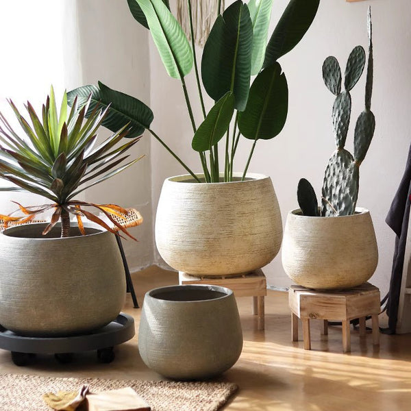 Scored Globe Cement Planter — globe-form magnesium oxide planter with horizontal scoring, two colors, two sizes
