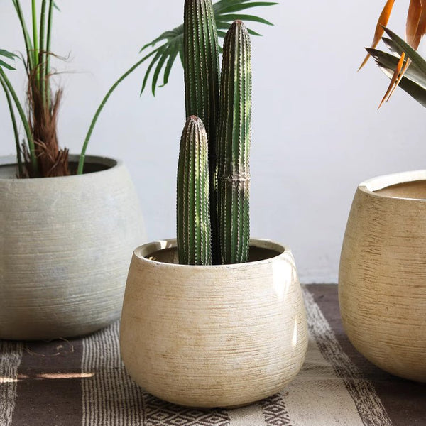 Scored Globe Cement Planter — globe-form magnesium oxide planter with horizontal scoring, two colors, two sizes