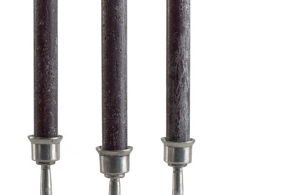 Three black taper candles, taper