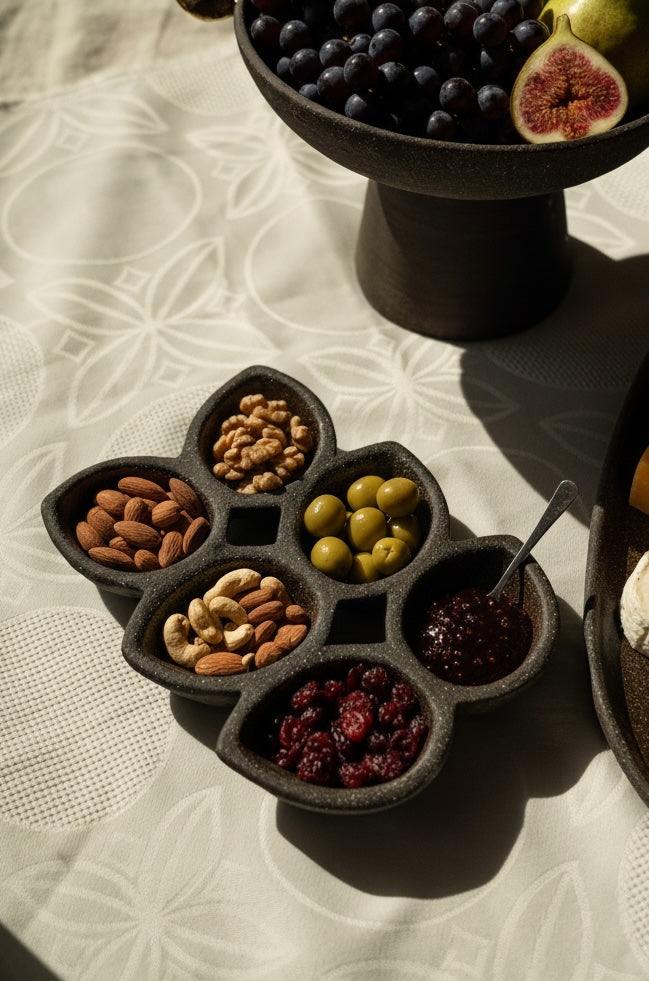 Dark Stoneware Multi-Well Serving Dish — Six-well stoneware serving dish in a raw, dark earthy finish for grazing