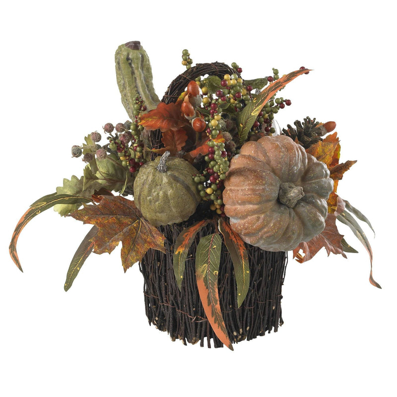 An autumn pumpkin and berry arrangement for a table