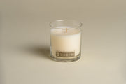 Herb & Citrus Hand-Poured Soy Candle styled on a table with linen and ceramics