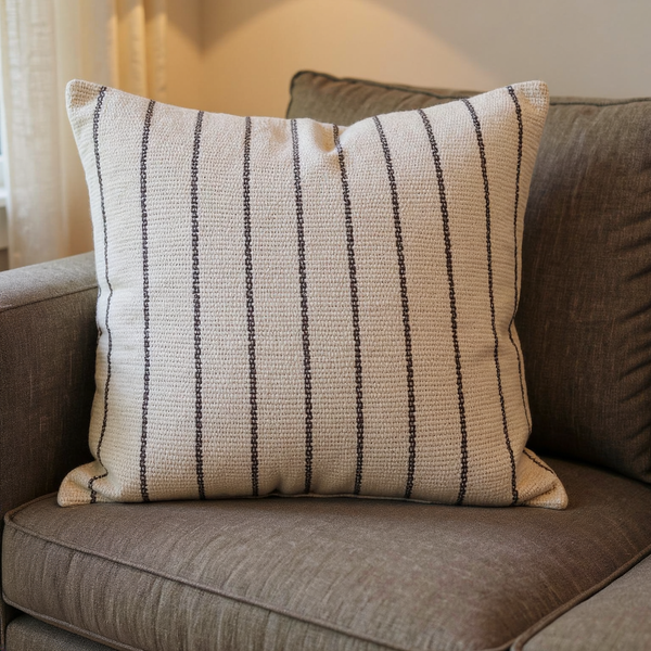 Backstrap-Woven Striped Cotton Pillow Cover in a close view on coordinated upholstered seating