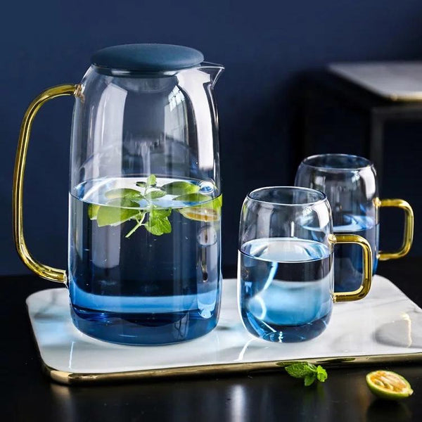 Ombre Glass Pitcher and Cup Set — Gradient tinted glass pitcher and two handled cups with gold-tone accents