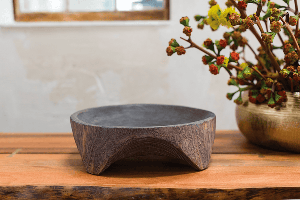 Smoke-Finished Carved Hardwood Bowl styled on a kitchen counter with produce