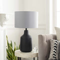 Matte Concrete Base Table Lamp — Concrete-base table lamp with grey drum shade for bedside or console