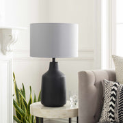 Matte Concrete Base Table Lamp — Concrete-base table lamp with grey drum shade for bedside or console