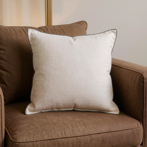 Cotton Throw Pillow with Charcoal Piping in a close view on coordinated upholstered seating