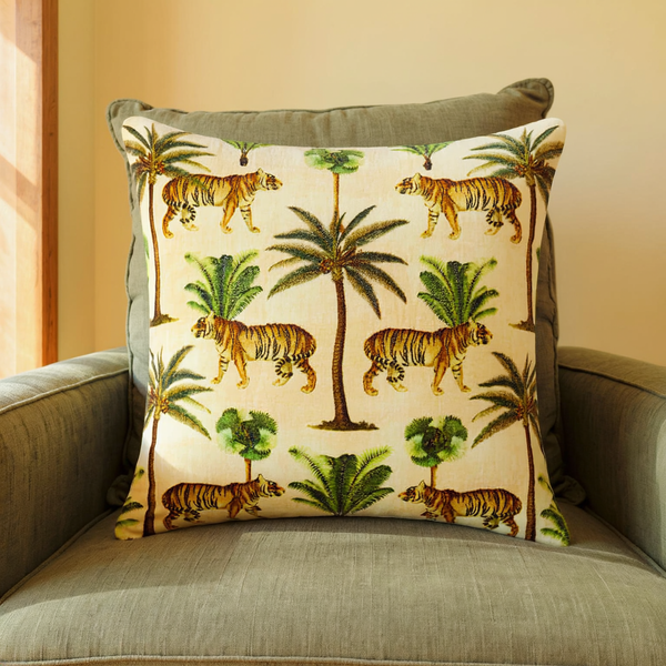 Cotton Velvet Tiger Print Throw Pillow in a close view on coordinated upholstered seating