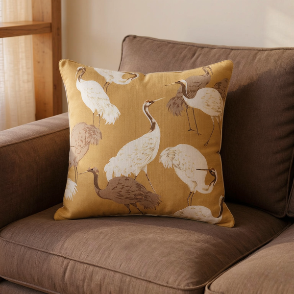 Crane Print Cotton Slub Pillow in a close view on coordinated upholstered seating