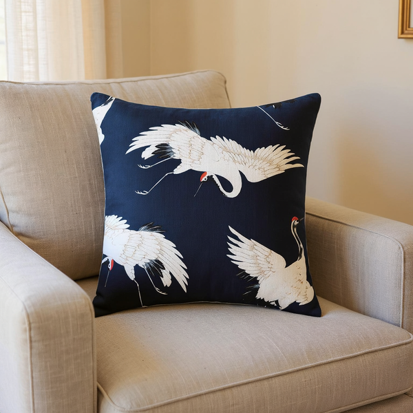 Crane Print Cotton Throw Pillow in a close view on coordinated upholstered seating