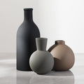 Matte Ceramic Vase Set — Three matte ceramic forms in tonal neutrals, shaped for shelves and sideboards