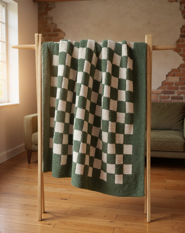 Double-Knit Checkerboard Bouclé Throw styled in a warm editorial loft
