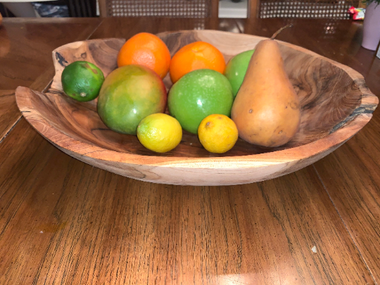 Live Edge Hand-Carved Teak Bowl styled on a kitchen counter with produce