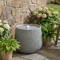 Ridged Concrete-Finish Bowl Fountain — Ridged bowl fountain in concrete-finish gray with gentle spout and LED light