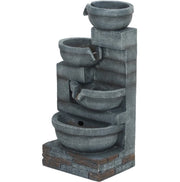 Four-Tier Cascading Resin Garden Fountain as a garden focal point with native plants
