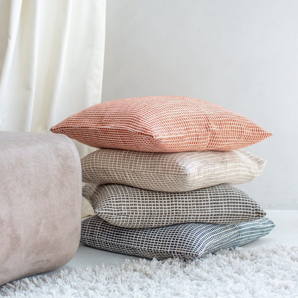 The daily cushion that earns its corner of the sofa