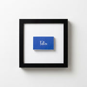 Wood-Frame Script Art Print — Cobalt script print in a wood-grain frame, available in three finishes