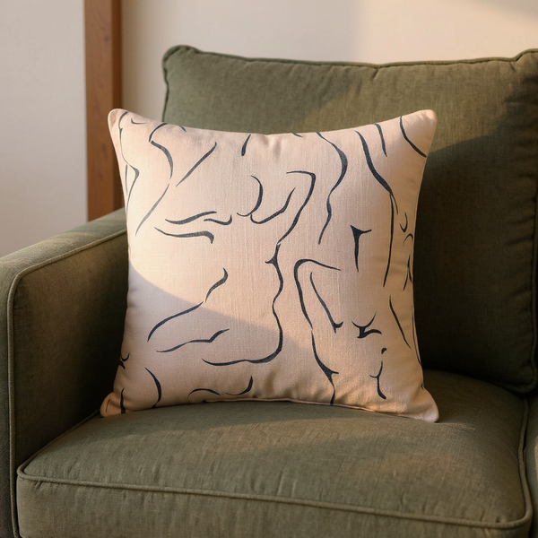 Figure-Print Cotton Slub Throw Pillow in a close view on coordinated upholstered seating