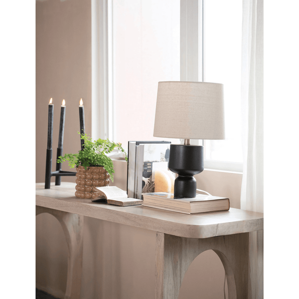 Textured Metal Triple Taper Candle Holder in Black styled on a table with linen and ceramics