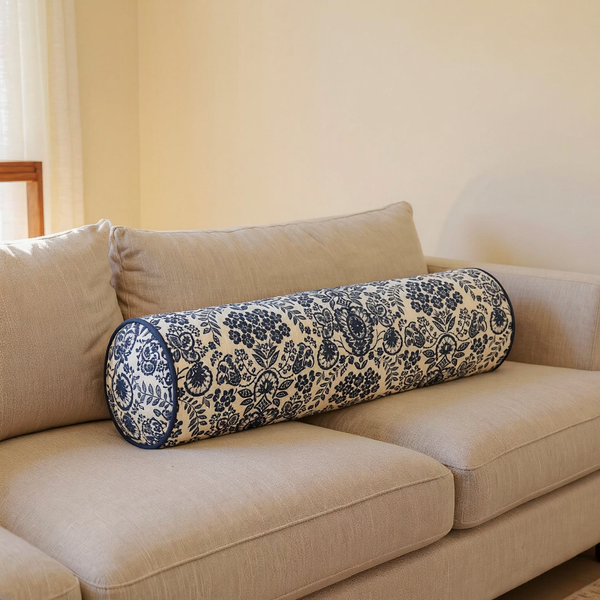 Floral Print Cotton Bolster Pillow in a close view on coordinated upholstered seating
