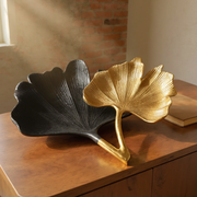 Matte Black Gold Ginkgo Leaf Tray Set styled in a warm editorial loft