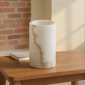 Hand-Cut Alabaster Tealight Holder styled in a warm editorial loft