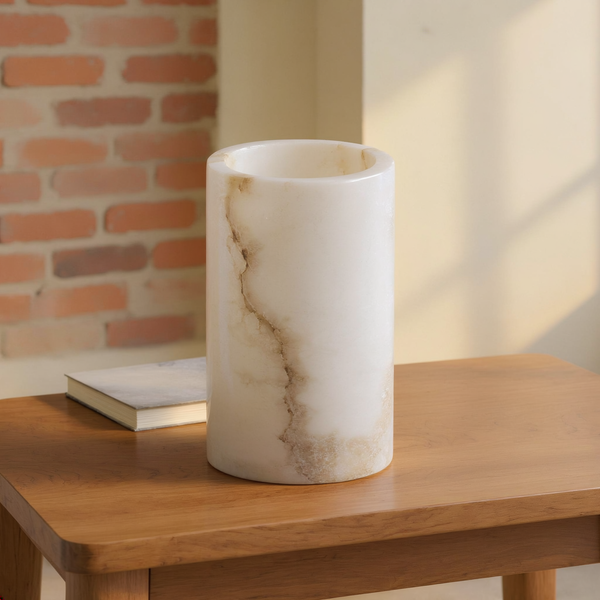 Hand-Cut Alabaster Tealight Holder styled in a warm editorial loft