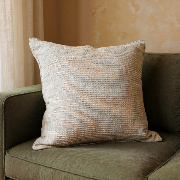 Hand-Woven Cotton Pillow Cover in a close view on coordinated upholstered seating