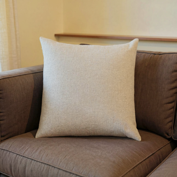 Kameron Pillow - Light Beige - 2 Sizes in a close view on coordinated upholstered seating