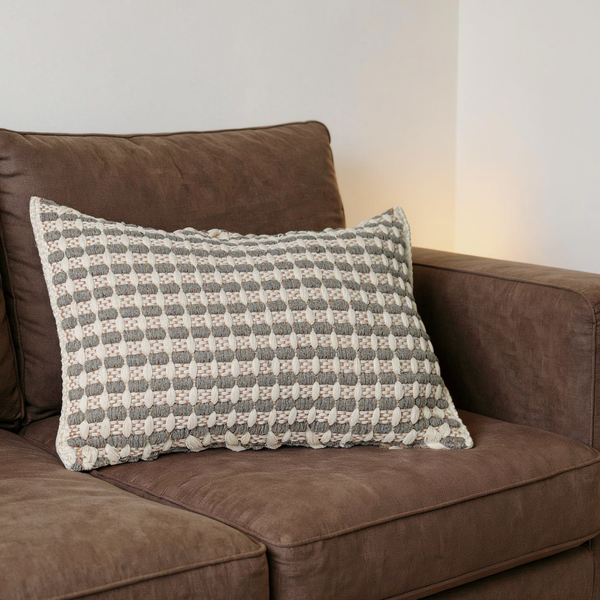 Lattice Woven Cotton Pillow Cover in a close view on coordinated upholstered seating