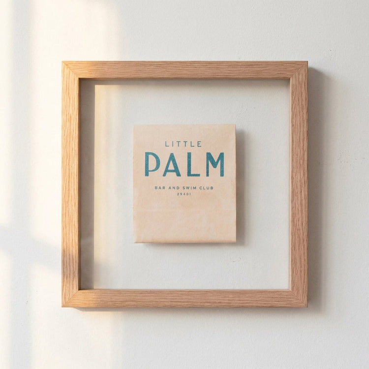 Wood-Frame Palm Bar Print — Typographic bar print in a wood-grain frame, two sizes available