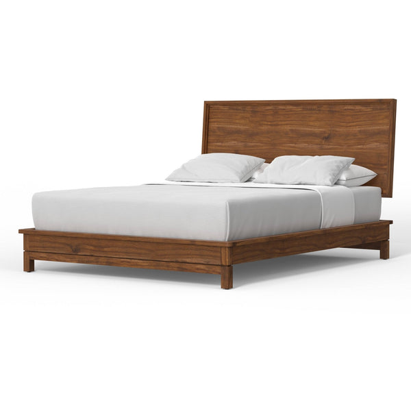 Honey-brown panel bed with white mattress and pillows viewed diagonally against white.