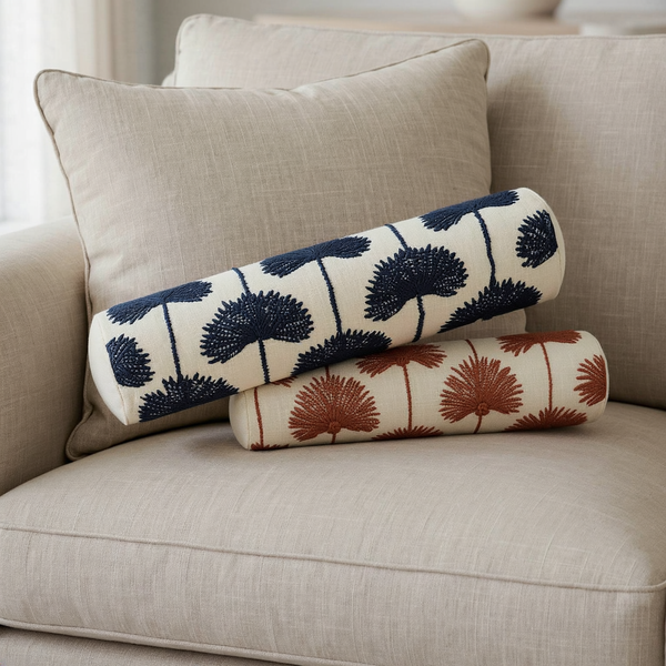 Palm Leaf Embroidered Bolster Pillow styled on coordinated seating