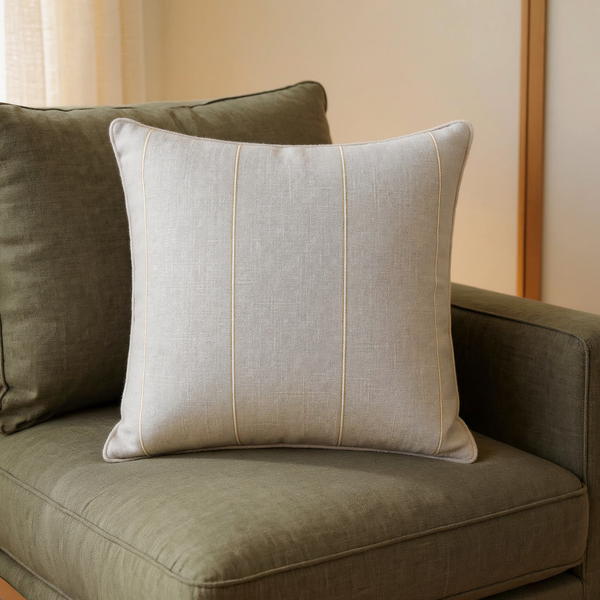 Piped Cotton Reversible Throw Pillow in a close view on coordinated upholstered seating