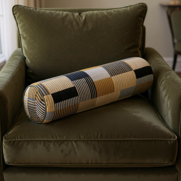 Geometric Plaid Cotton Slub Bolster Pillow styled on coordinated seating