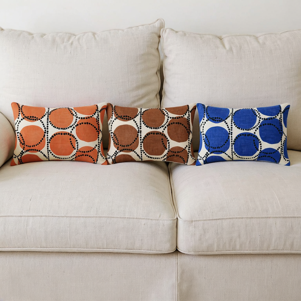 Printed Cotton Slub Lumbar Pillow color options styled together on coordinated seating