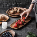 Oval Wood Serving Board Set in a styled home setting