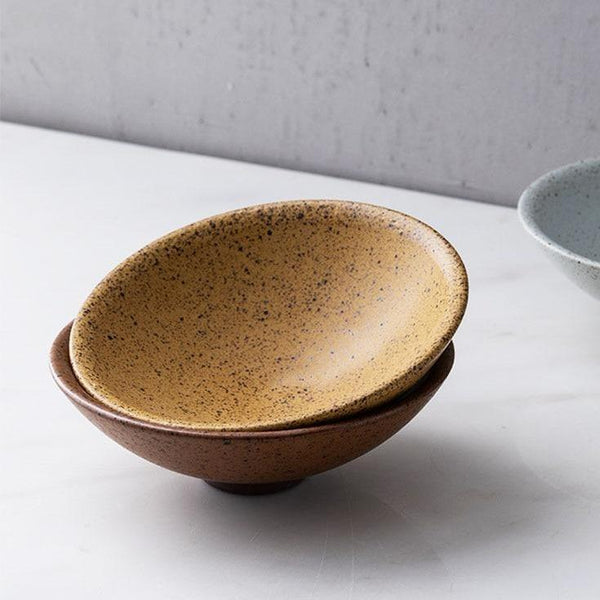 Speckled Ceramic Bowl Set styled on a kitchen counter with produce