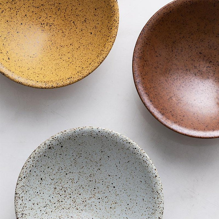 Speckled Ceramic Bowl Set — Set of three speckled ceramic bowls in ochre, terracotta, and ash-white