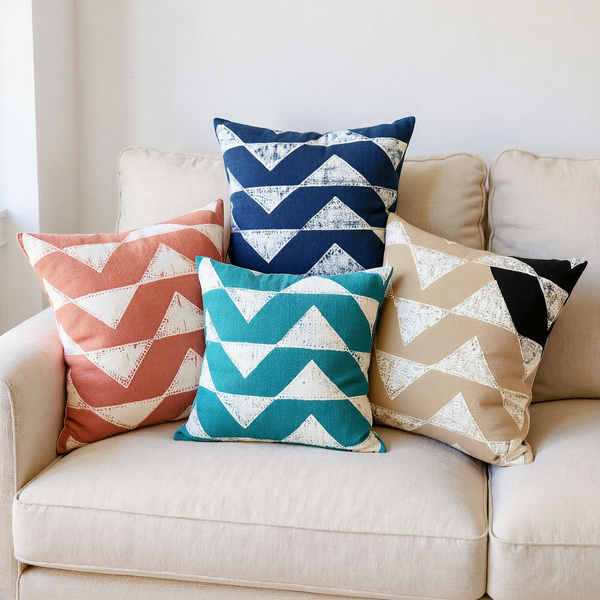 Resist-Painted Cotton Pillow Cover color options styled together on coordinated seating