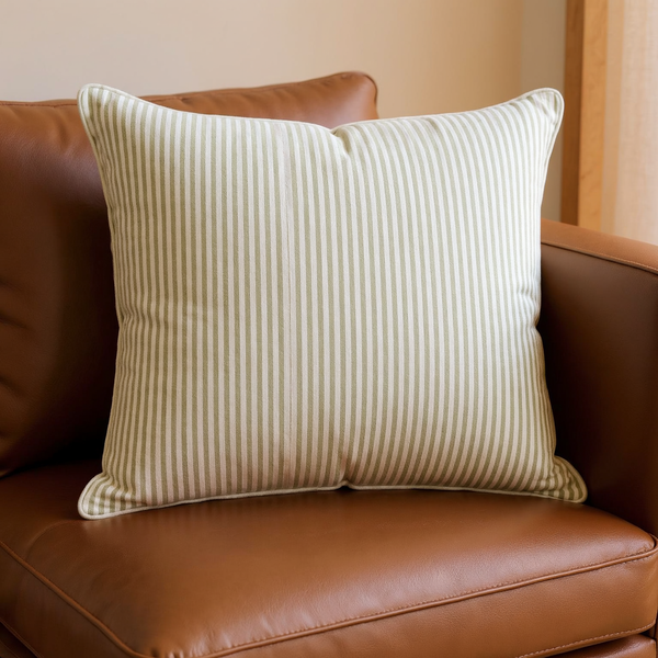Reversible Cotton Stripe Throw Pillow in a close view on coordinated upholstered seating